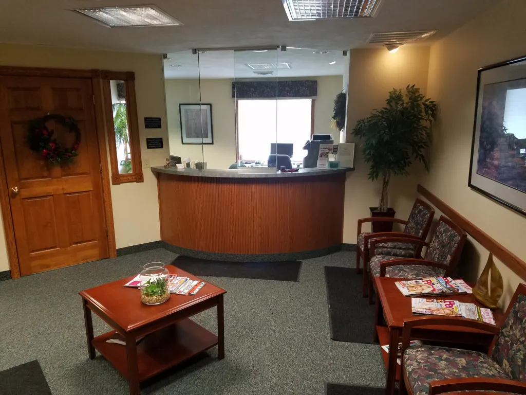 Reception Area with front desk and chairs at [LAST_NAME]'s practice