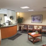 Reception Area with front desk and chairs at [LAST_NAME]'s practice
